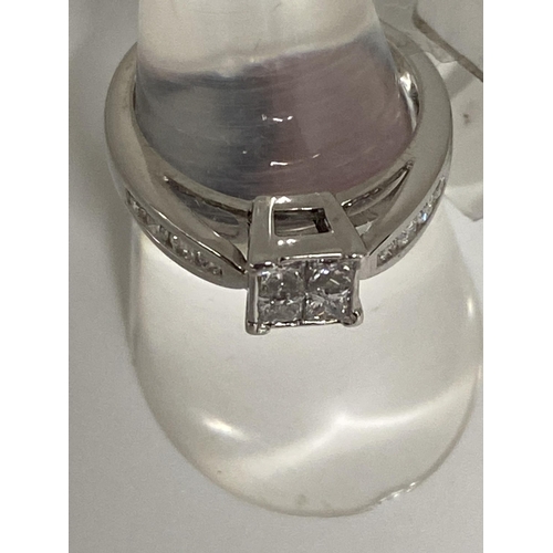 189 - 18ct white gold  diamond ring, approx size 0.60cts of diamond in a square design with diamonds to mo... 