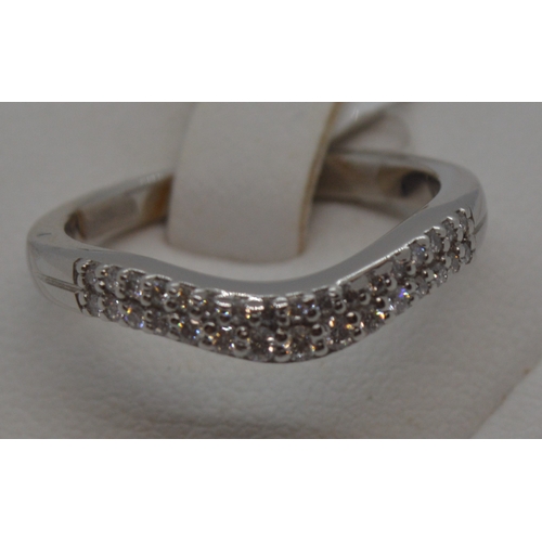 192 - Platinum and diamond ring featuring a double row of diamonds,  approx 0.30ct, approx size M.  Hallma... 