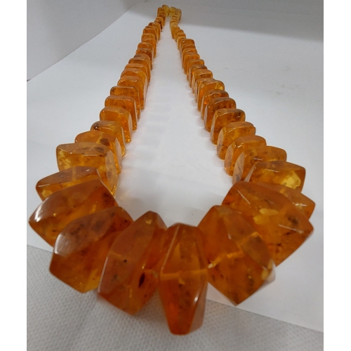 57 - Chunky graduated amber necklace, approx gross weight 195g