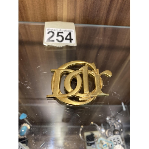 254 - Christian Dior interlocking gold tone monogram brooch