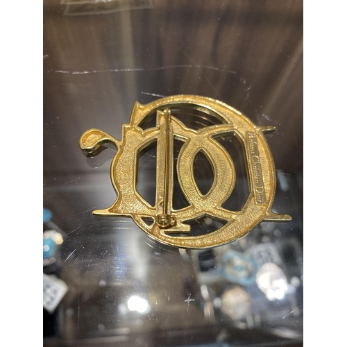 254 - Christian Dior interlocking gold tone monogram brooch