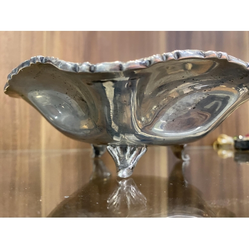 281 - Sterling silver decorative fluted dish standing on three feet and weighing approx 264gms