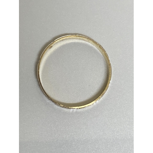 100 - White and yellow gold band ring with screw head design, approx size V, stamped 750, approx 2g