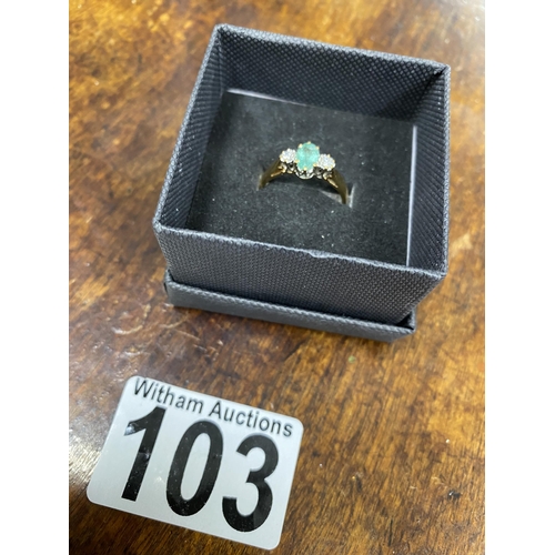 103 - A 9ct yellow gold ring with oval green central stone and a diamond either side of shank, approx size... 