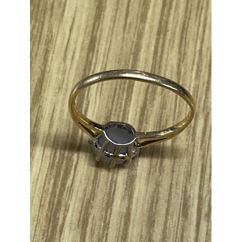 106 - A 9ct gold ring with moonstone in claw setting, Hallmarked 385, approx 2g gross weight