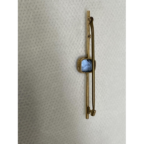 141 - A vintage 9ct yellow gold bar brooch with central blue stone possible aquamarine in vintage box, mar... 