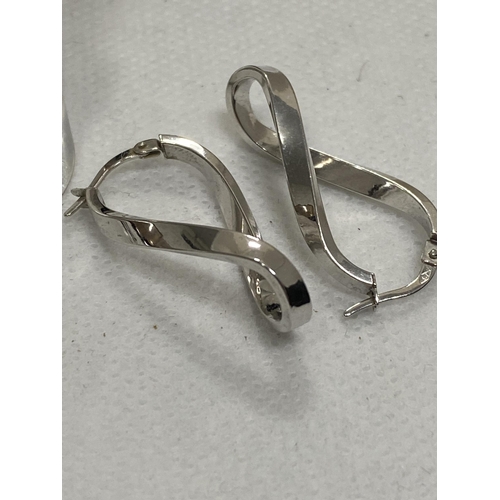 231 - A pair of 9ct white gold twisted elongated hoop design earrings, stamped 375 together with a silver ... 