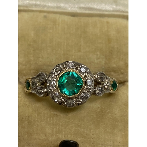 94 - Vintage 18 ct yellow gold diamond and green stone ring, the central green circular stone surrounded ... 