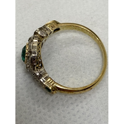 94 - Vintage 18 ct yellow gold diamond and green stone ring, the central green circular stone surrounded ... 