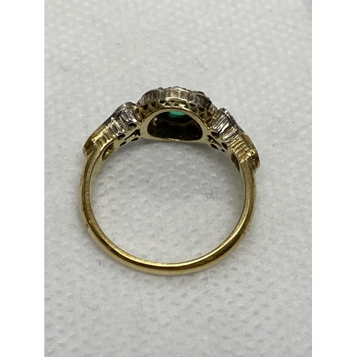 94 - Vintage 18 ct yellow gold diamond and green stone ring, the central green circular stone surrounded ... 