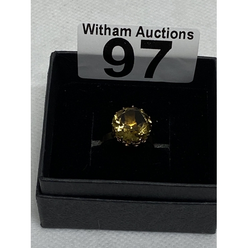 97 - 9ct gold yellow gemstone ring set in raised claw setting, approx size L, hallmarked London 375