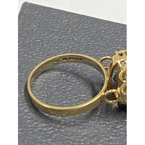 97 - 9ct gold yellow gemstone ring set in raised claw setting, approx size L, hallmarked London 375