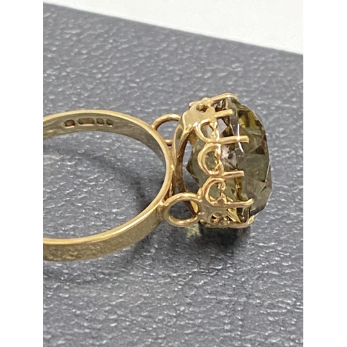 97 - 9ct gold yellow gemstone ring set in raised claw setting, approx size L, hallmarked London 375