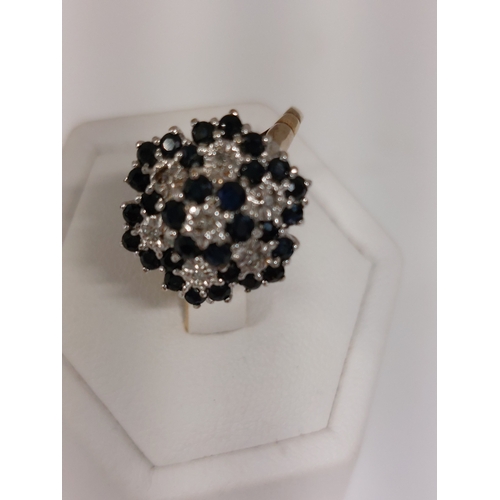 93 - A 9ct yellow gold diamond and Sapphire cluster ring, hallmarked 375 London approx size P