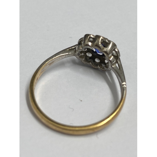 92 - Yellow gold ring 9ct gold ring with central blue stone (poss sapphire) and clear stones, hallmarked ... 