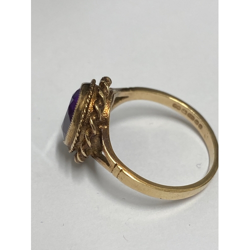 91 - 9ct gold ring set with central amethyst oval stone, hallmarked Birmingham, approx size o