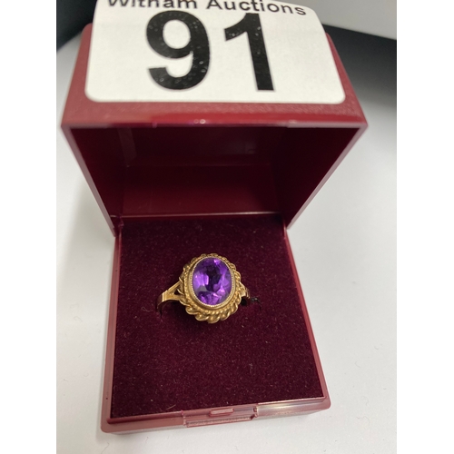 91 - 9ct gold ring set with central amethyst oval stone, hallmarked Birmingham, approx size o