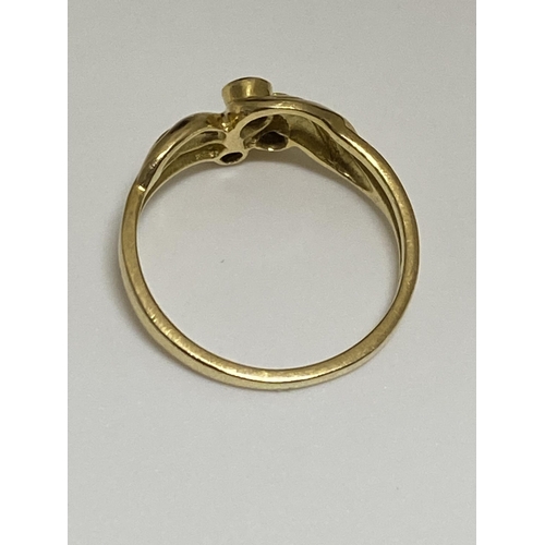 125 - 18ct yellow gold ring with a three singular set diamond design, stamped 750, approx size J