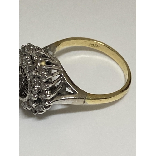 126 - A 18ct gold dress ring, graduating raised mount design with approx .20ct raised central stone with s... 