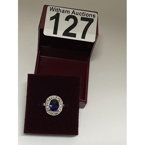 127 - 18ct white gold oval design dress ring with sapphire and diamond surround, approx size O, stamped 18... 