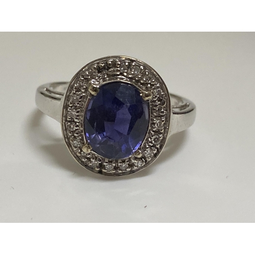 127 - 18ct white gold oval design dress ring with sapphire and diamond surround, approx size O, stamped 18... 