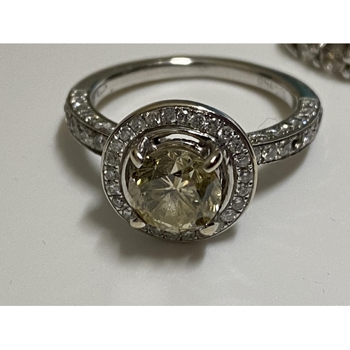 131 - A 18ct white gold and diamond (yellow) ring stamped 18k 750 together with 14ct white gold diamond et... 