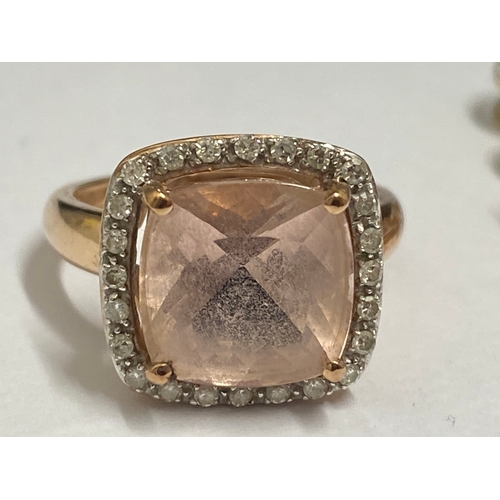 132 - 9ct gold ring with faceted square cut pink central stone with diamond surround marked QVC, approx si... 