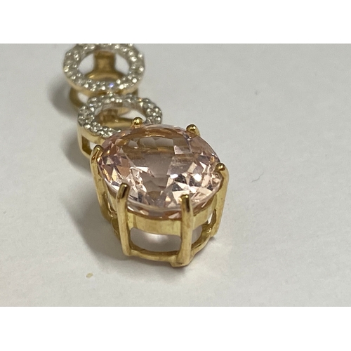 132 - 9ct gold ring with faceted square cut pink central stone with diamond surround marked QVC, approx si... 