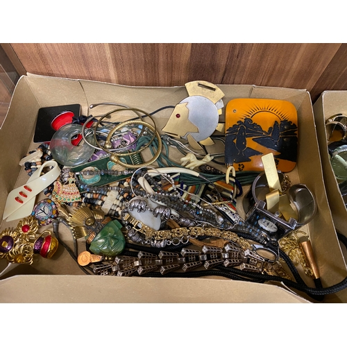 261 - A large quantity of mixed costume jewellery including bangles, beads, earrings, necklaces and bracel... 