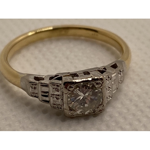 212 - 18ct yellow and white gold diamond solitaire  in a square setting with tiered gallery design , appro... 