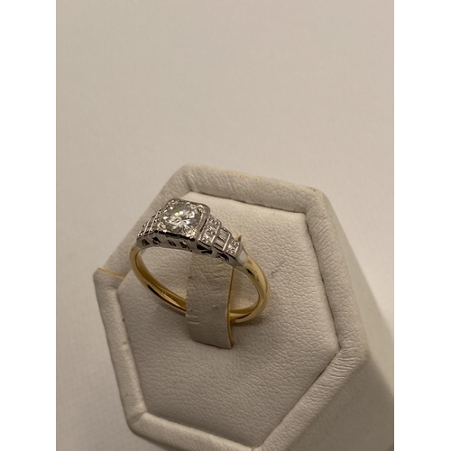 212 - 18ct yellow and white gold diamond solitaire  in a square setting with tiered gallery design , appro... 