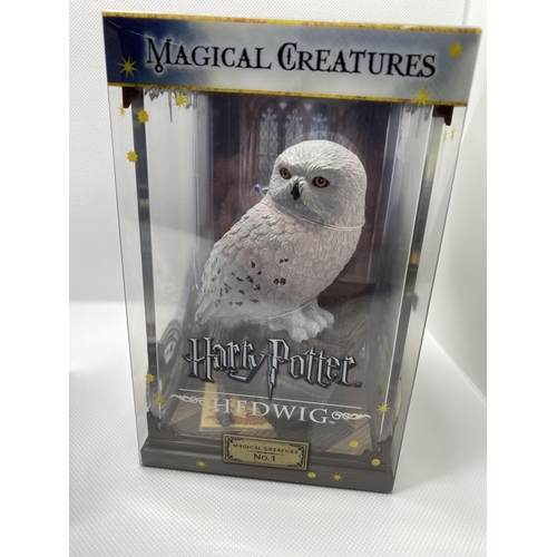 31 - Two boxed Warner Brothers Harry Potter  Magical Creatures figures no.1 ‘Hedwig’ and  no.6 ‘Buckbeak’... 