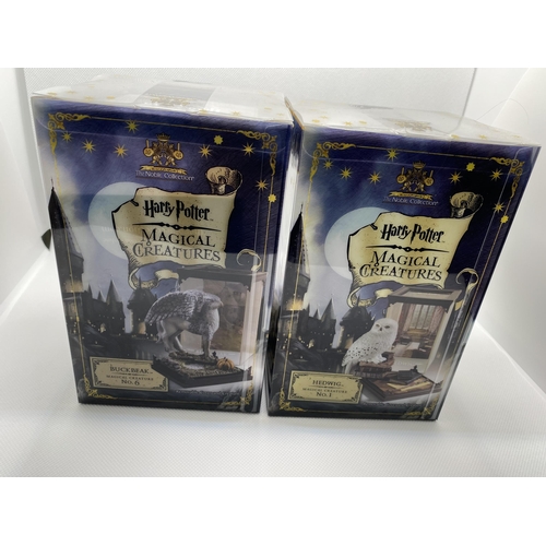 31 - Two boxed Warner Brothers Harry Potter  Magical Creatures figures no.1 ‘Hedwig’ and  no.6 ‘Buckbeak’... 