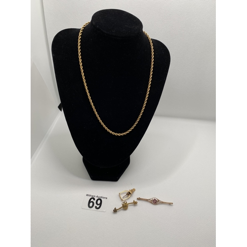 69 - An 18” gold rope chain necklace marked 9k made in Italy, together with a vintage gold brooch with ce... 