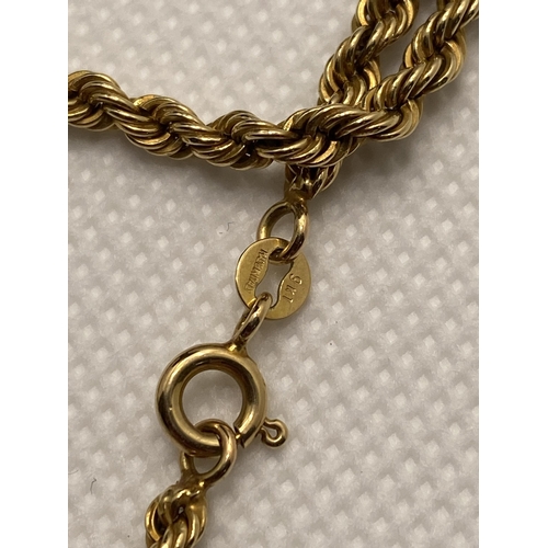 69 - An 18” gold rope chain necklace marked 9k made in Italy, together with a vintage gold brooch with ce... 