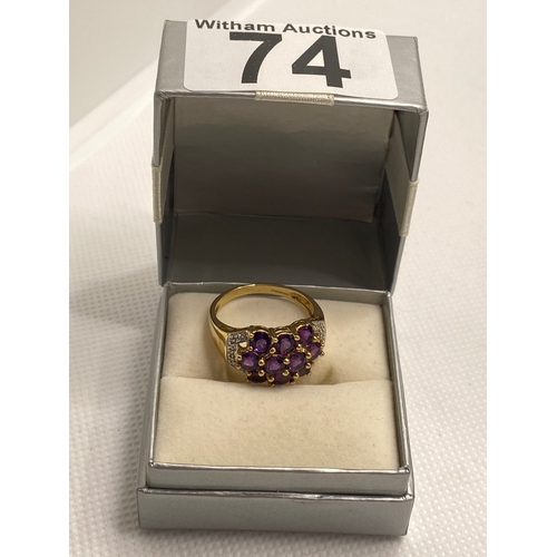 74 - A 9ct yellow gold with purple stone (poss amethyst) cluster ring, hallmarked Birmingham QVC, approx ... 