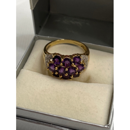 74 - A 9ct yellow gold with purple stone (poss amethyst) cluster ring, hallmarked Birmingham QVC, approx ... 