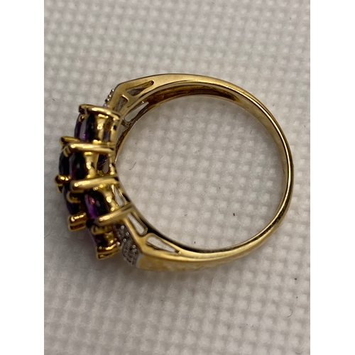 74 - A 9ct yellow gold with purple stone (poss amethyst) cluster ring, hallmarked Birmingham QVC, approx ... 