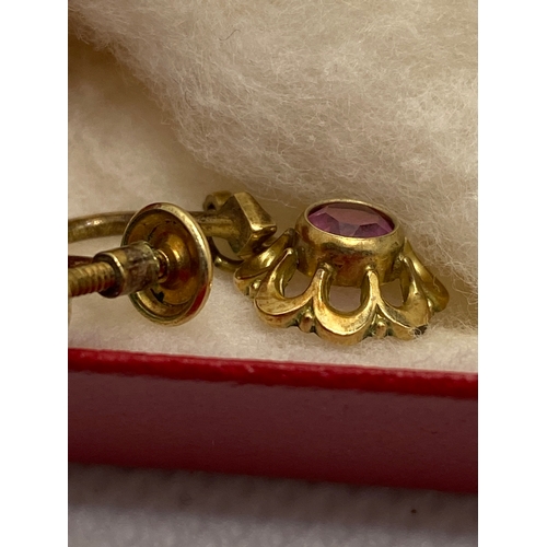 208 - A pair of vintage screw back earrings with pink stone, marked 14ct