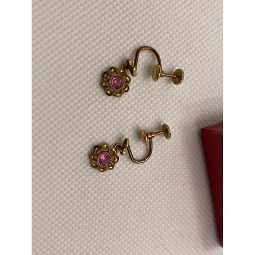 208 - A pair of vintage screw back earrings with pink stone, marked 14ct