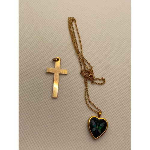 216 - A 9ct yellow gold cross pendant (approx 3.5cm in length) together with 9ct gold heart shaped pendant... 