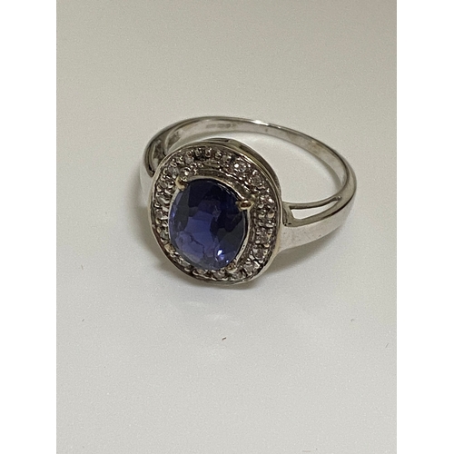 127 - 18ct white gold oval design dress ring with sapphire and diamond surround, approx size O, stamped 18... 