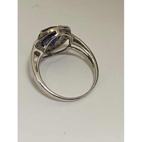 127 - 18ct white gold oval design dress ring with sapphire and diamond surround, approx size O, stamped 18... 