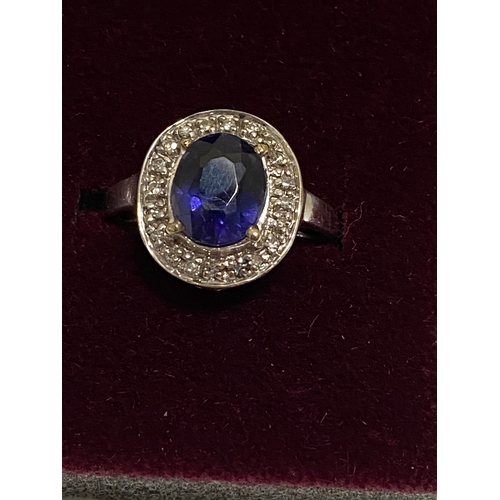 127 - 18ct white gold oval design dress ring with sapphire and diamond surround, approx size O, stamped 18... 