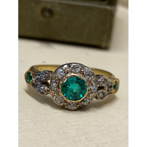 94 - Vintage 18 ct yellow gold diamond and green stone ring, the central green circular stone surrounded ... 