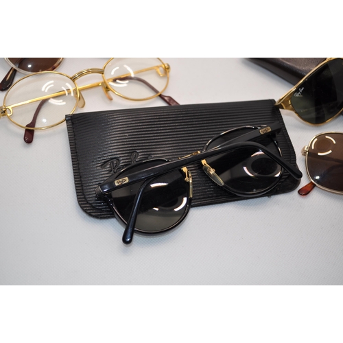 104 - A variety of retro sunglasses in different shapes and colours including a pair of retro gold-coloure... 