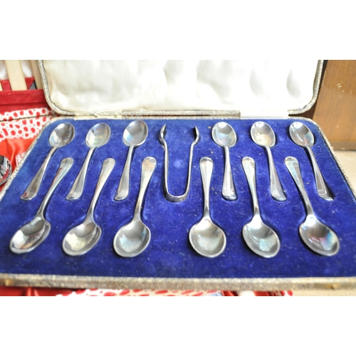 127 - A boxed set of Walker and Hall tea spoons/sugar tongs together with a Webber and Hill cutlery set in... 