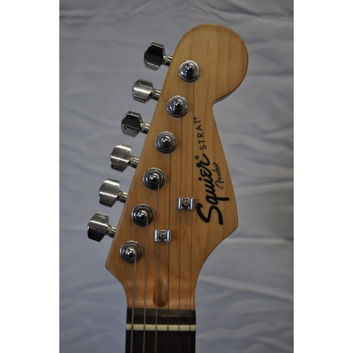 176 - Fender Squier Stratt black and cream six string electric guitar with TGI velvet strap