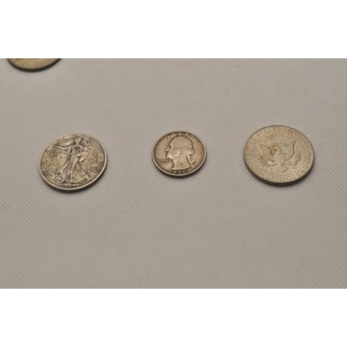 184 - A mixture of coins to include silver American coins including a 1943 walking liberty half dollar