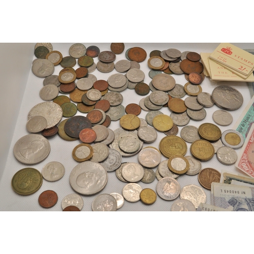 186 - An assortment of coins and notes from around the world